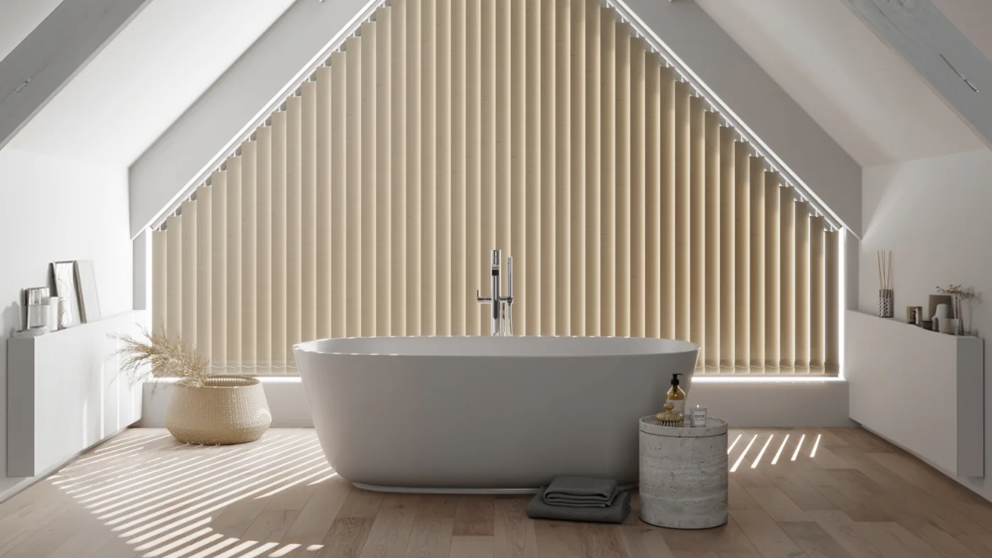 A bathroom under a pitched window, its full height dressed in vertical blinds.